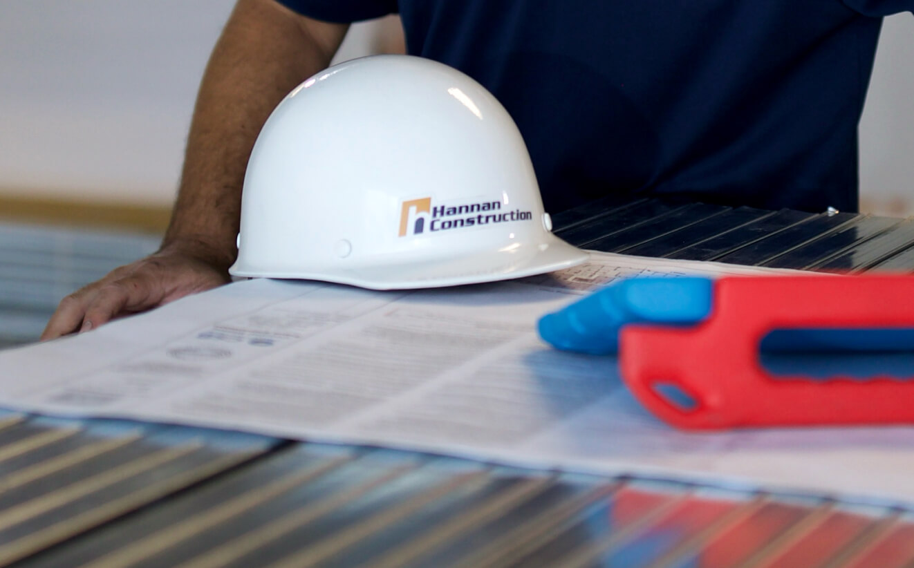 Hannan construction workers helmet on a table.